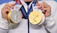 Katie Ledecky of Team USA poses with her two Gold and two Silver medals after a giving a press conference to the media during the Tokyo Olympic Games on July 31, 2021 in Tokyo, Japan. (Photo by Laurence Griffiths/Getty Images)